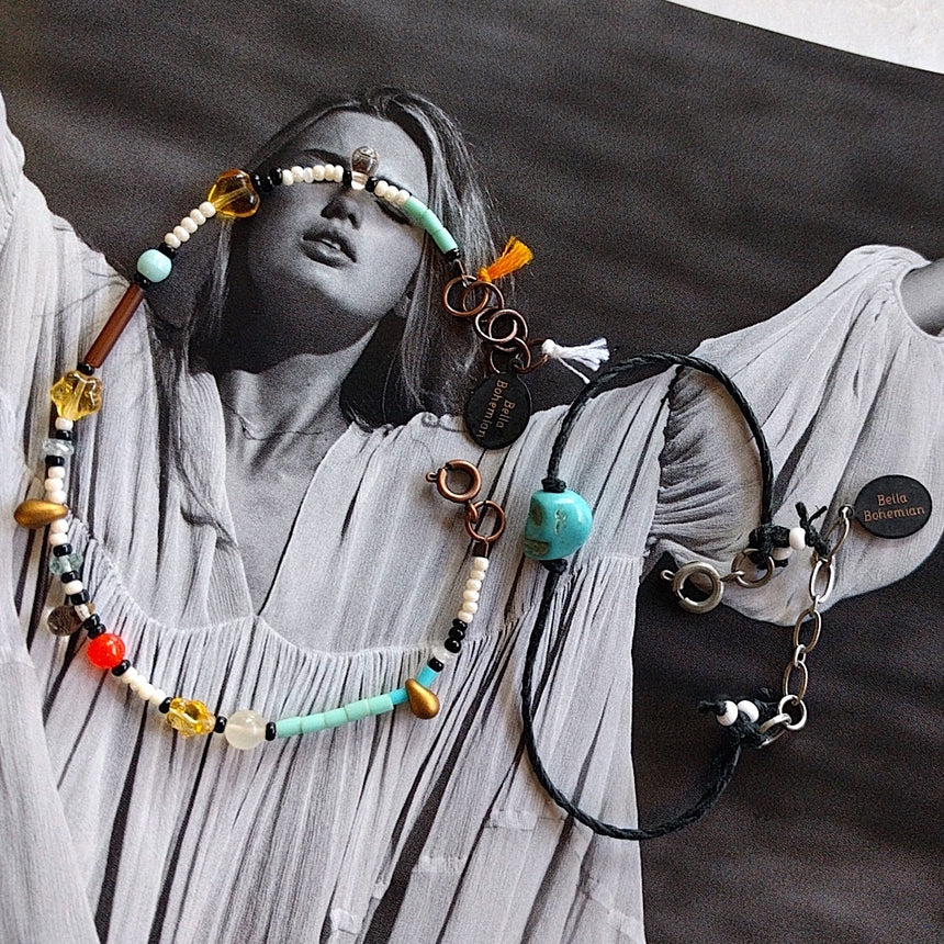 set of bracelets, one with black cotton thread, the other with multicolored seed and glass beads on alternate background