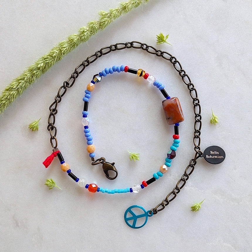 handmade friendship bracelets with colors of blue red amber and clear beads