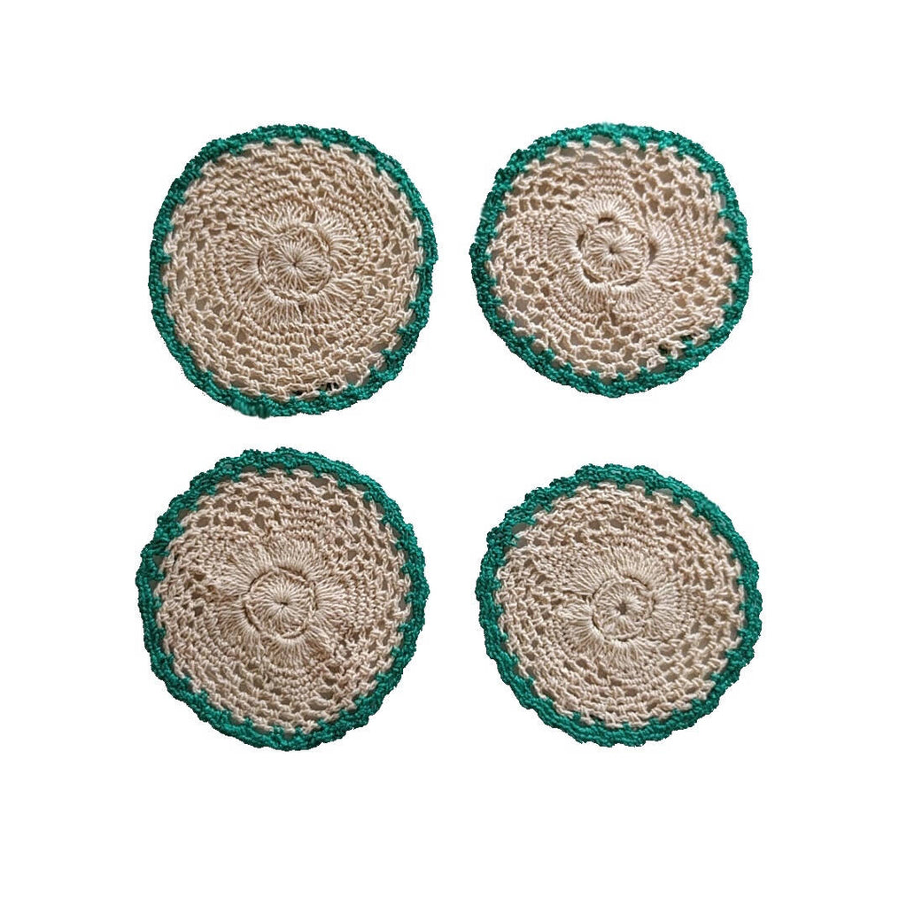 set of four round crochet cotton yarn coasters in tan color and teal border - plain image