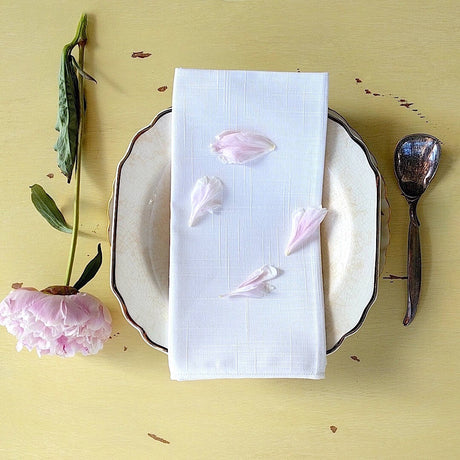 set of four square elegant white cotton napkins