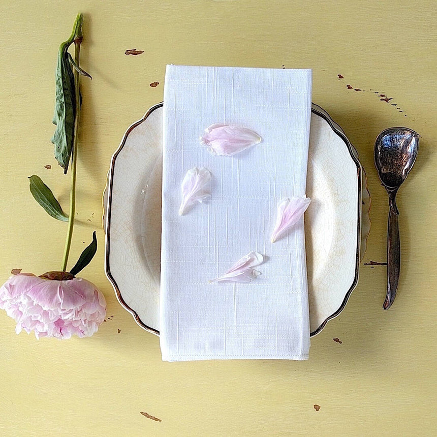 set of four square elegant white cotton napkins