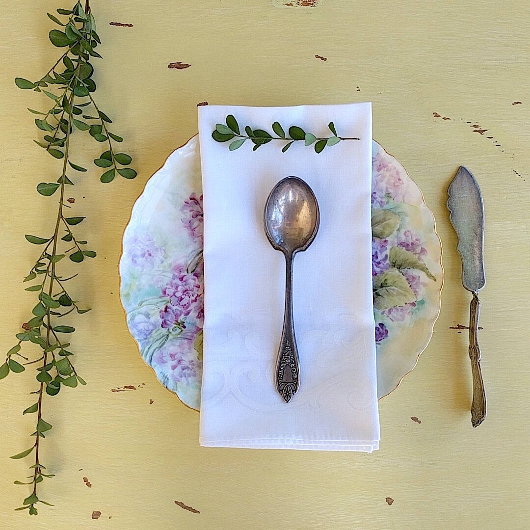 set of four square elegant white cotton napkins with flower pattern