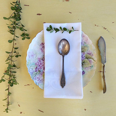 set of four square elegant white cotton napkins with flower pattern