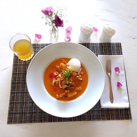 rectangular vinyl placemat shown with food and table setting