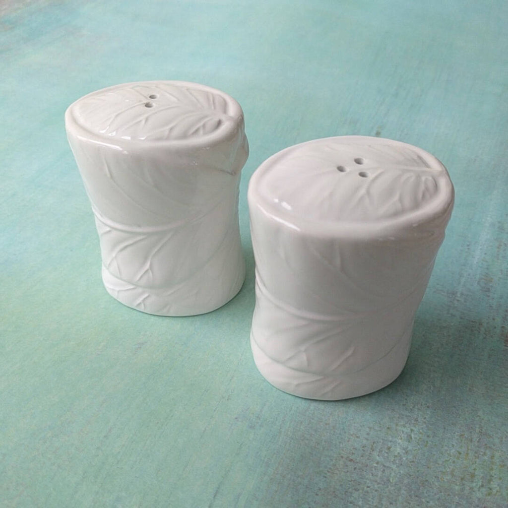 white ceramic set of salt and pepper shakers (3)