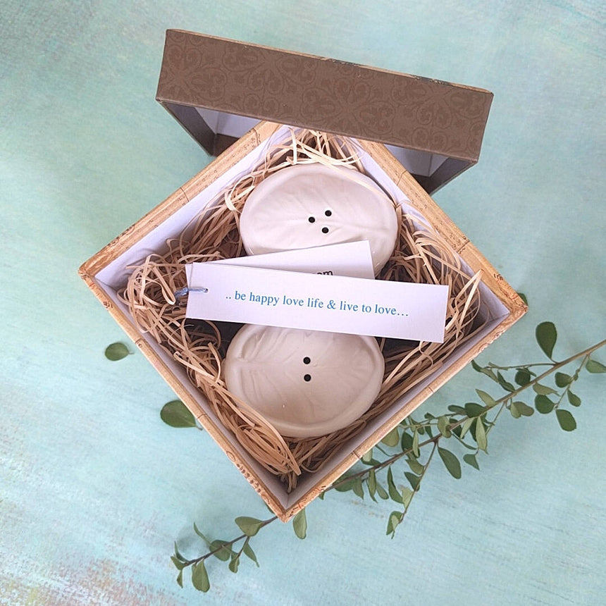 white ceramic set of salt and pepper shakers shown in gift box