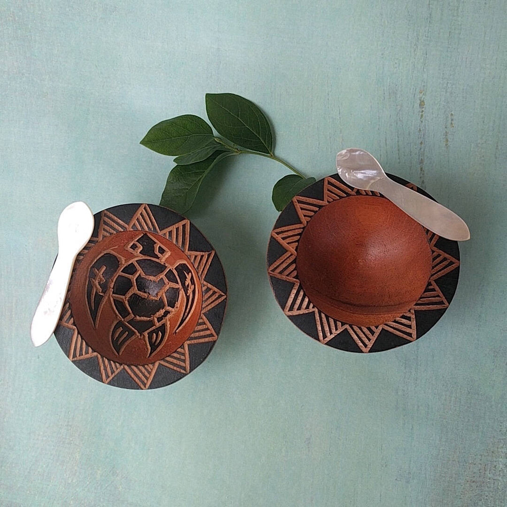 hand carved Fijian light wood salt and pepper cellars with turtle and sun designs