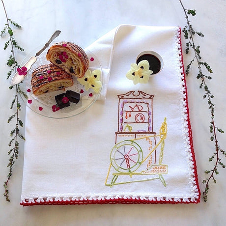 oversized white cotton tea towel with multicolored spinning wheel motif