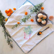 vintage embroidered cotton kitchen towel with red pot and green plant motif