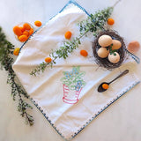 vintage embroidered cotton kitchen towel with red pot and green plant motif
