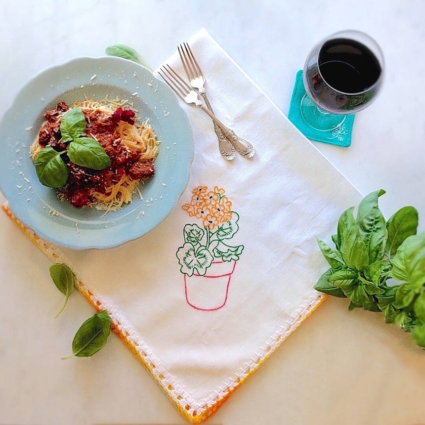 handmade white cotton kitchen towel with red pot and orange flower motif