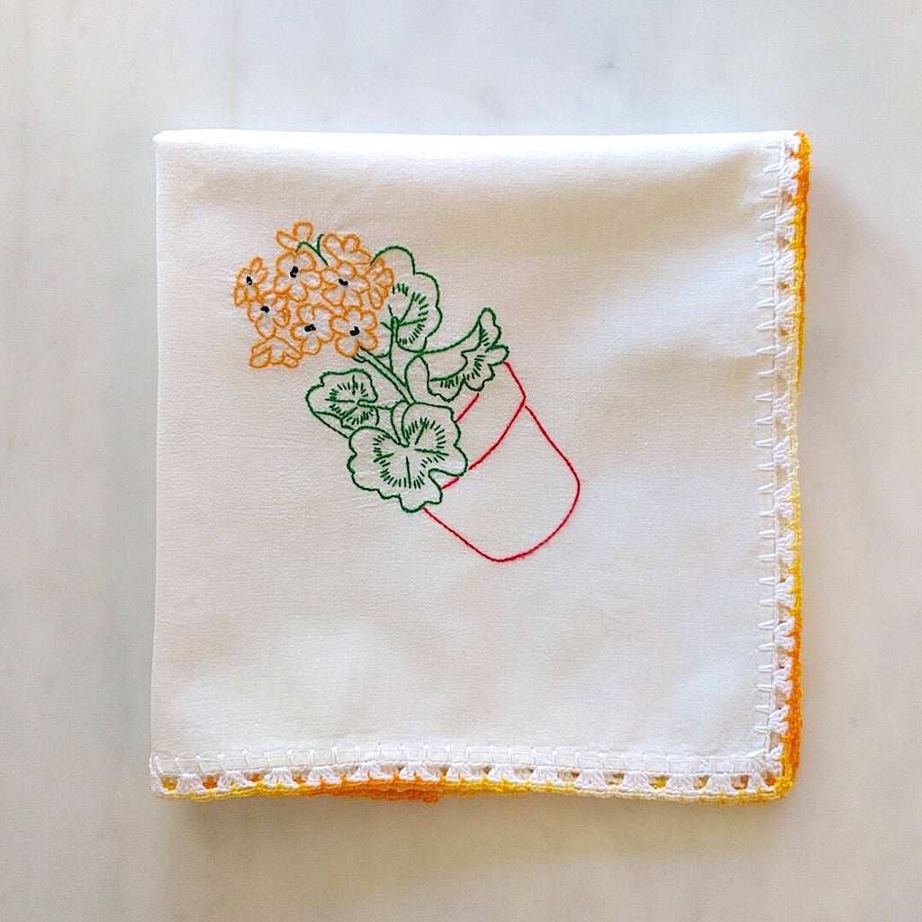 handmade white cotton kitchen towel with red pot and orange flower motif