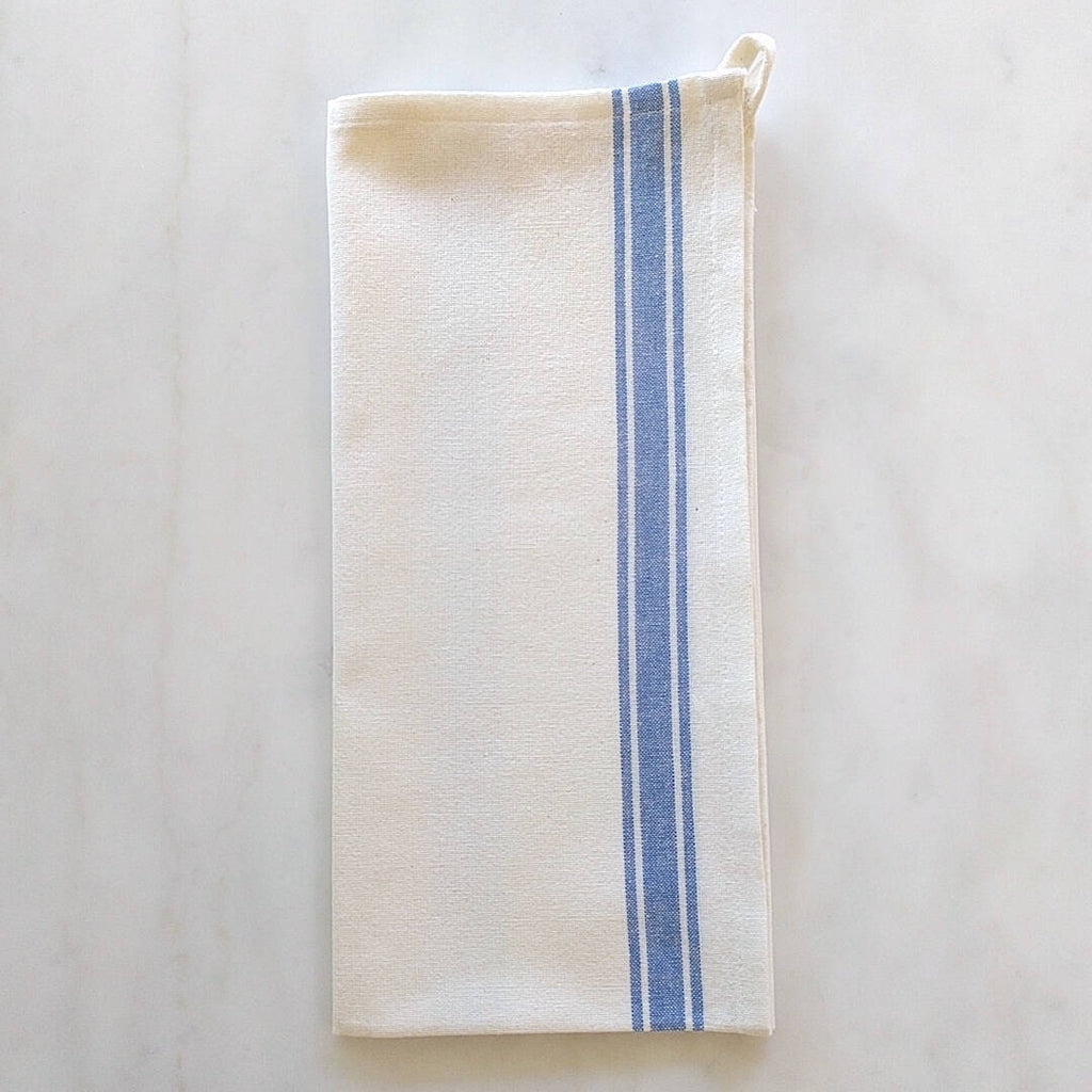 cream colored cotton tea towel with blue stripe