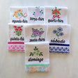 set of 7 cotton kitchen towels colorfully themed after each day of the week in Portuguese