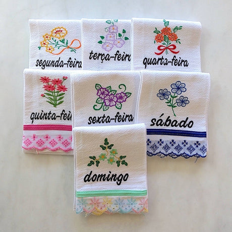 set of 7 cotton kitchen towels colorfully themed after each day of the week in Portuguese