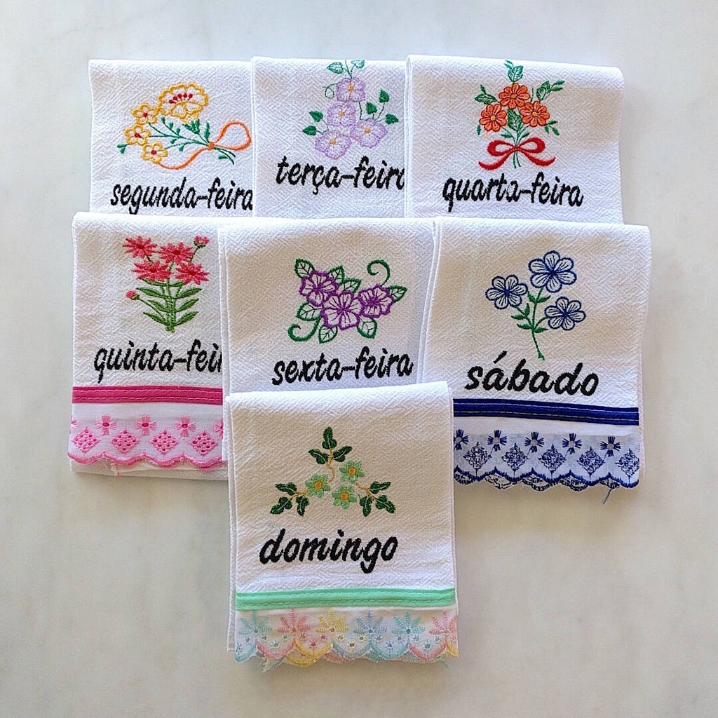 set of 7 cotton kitchen towels colorfully themed after each day of the week in Portuguese