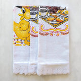 showing all three towels folded with lace trim