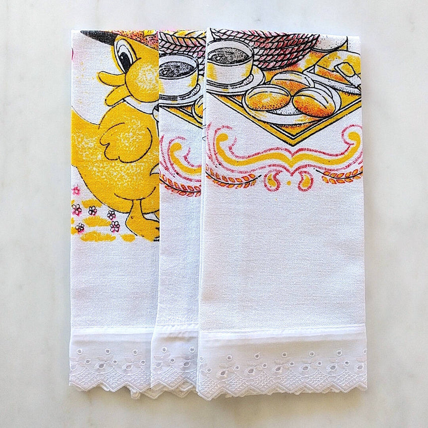showing all three towels folded with lace trim