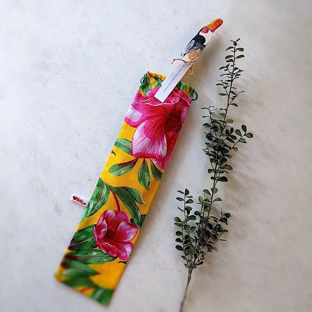 brazilian wood spoon with toucan head here shown with toucan sticking out from gift bag
