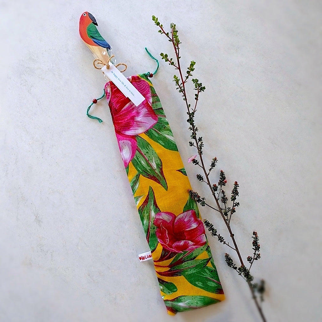 brazilian wood spoon with parrot head here shown with parrot sticking out from gift bag