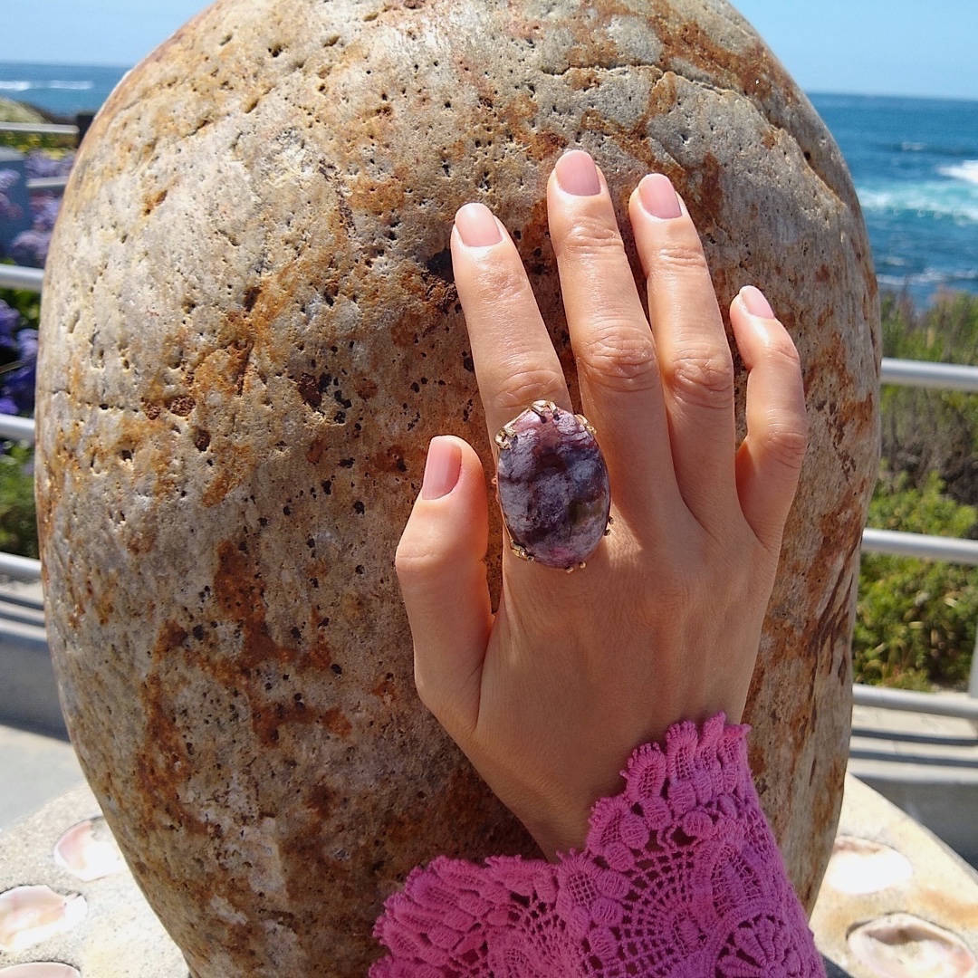 oval zebra Jasper gold-plated adjustable cocktail ring on a lady's hand