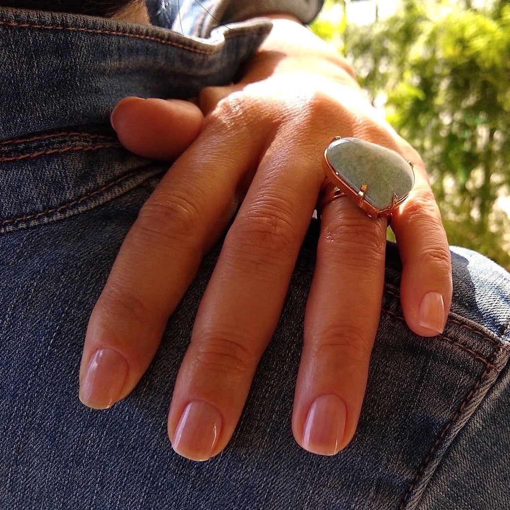 top down view of heart shaped amazonite cocktail ring on a lady's hand