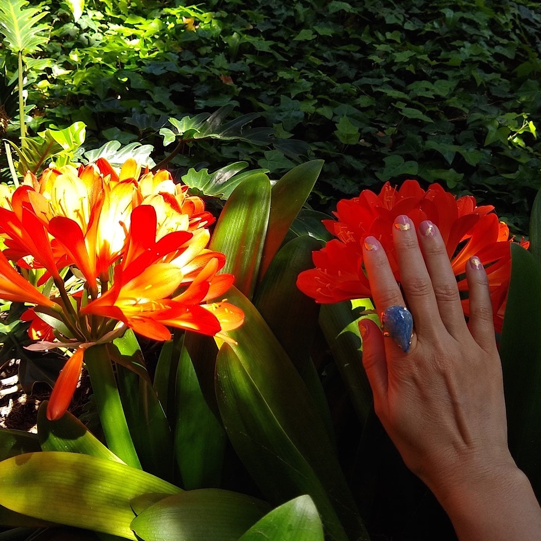 blue pear-shaped Quartz cocktail ring on a lady's hand