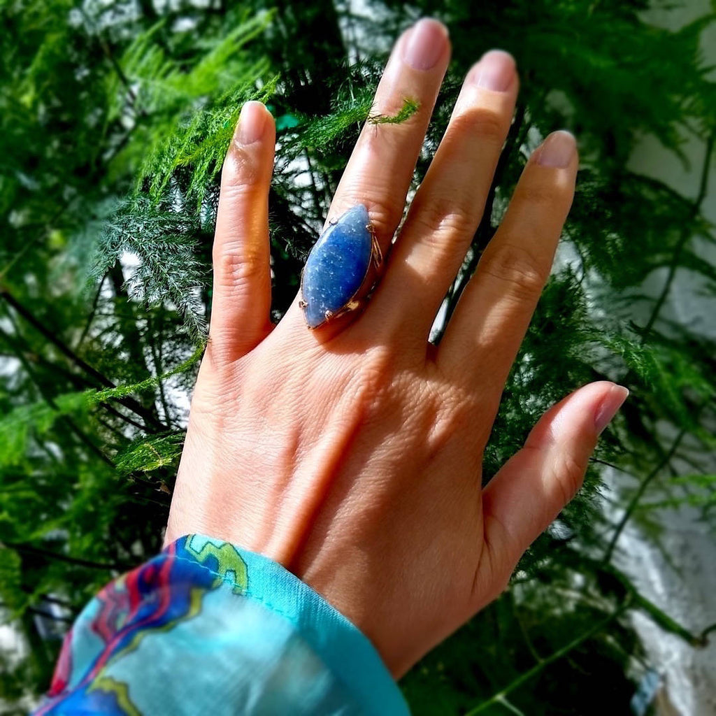 marquise shaped blue quartz cocktail ring on a lady's hand