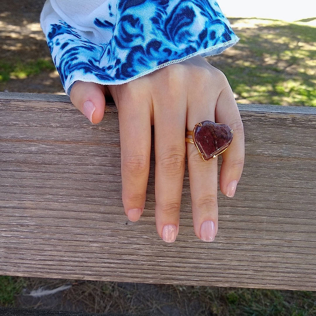 heart shaped dark Jasper cocktail ring on a lady's hand