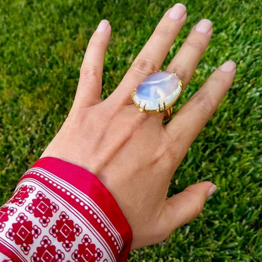 large oval Moonstone cocktail ring on a lady's hand