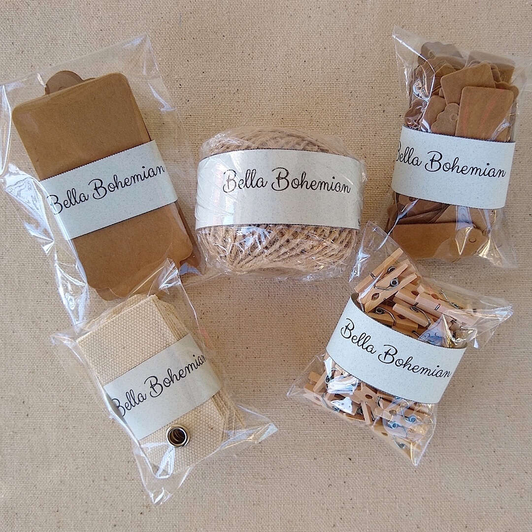 Kraft gift tags, cotton canvas tags, scalloped gift tags, jute twine, wood clothespins, plastic wrapped laid out flat