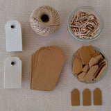 Kraft gift tags, cotton canvas tags, scalloped gift tags, jute twine, wood clothespins, laid out flat