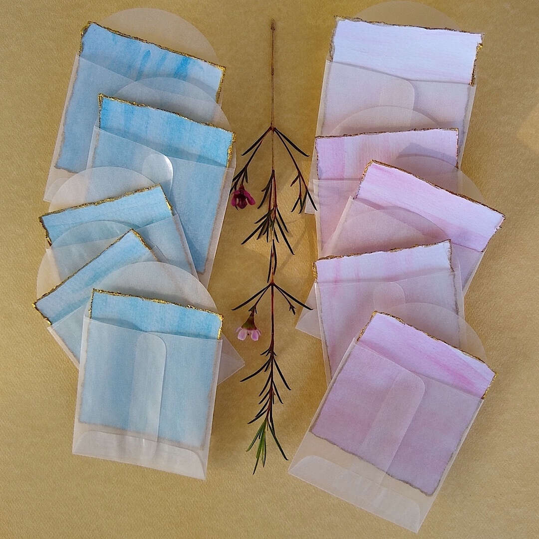 5 blue and 5 pink watercolor Thank You cards with gold trim in glassine envelopes