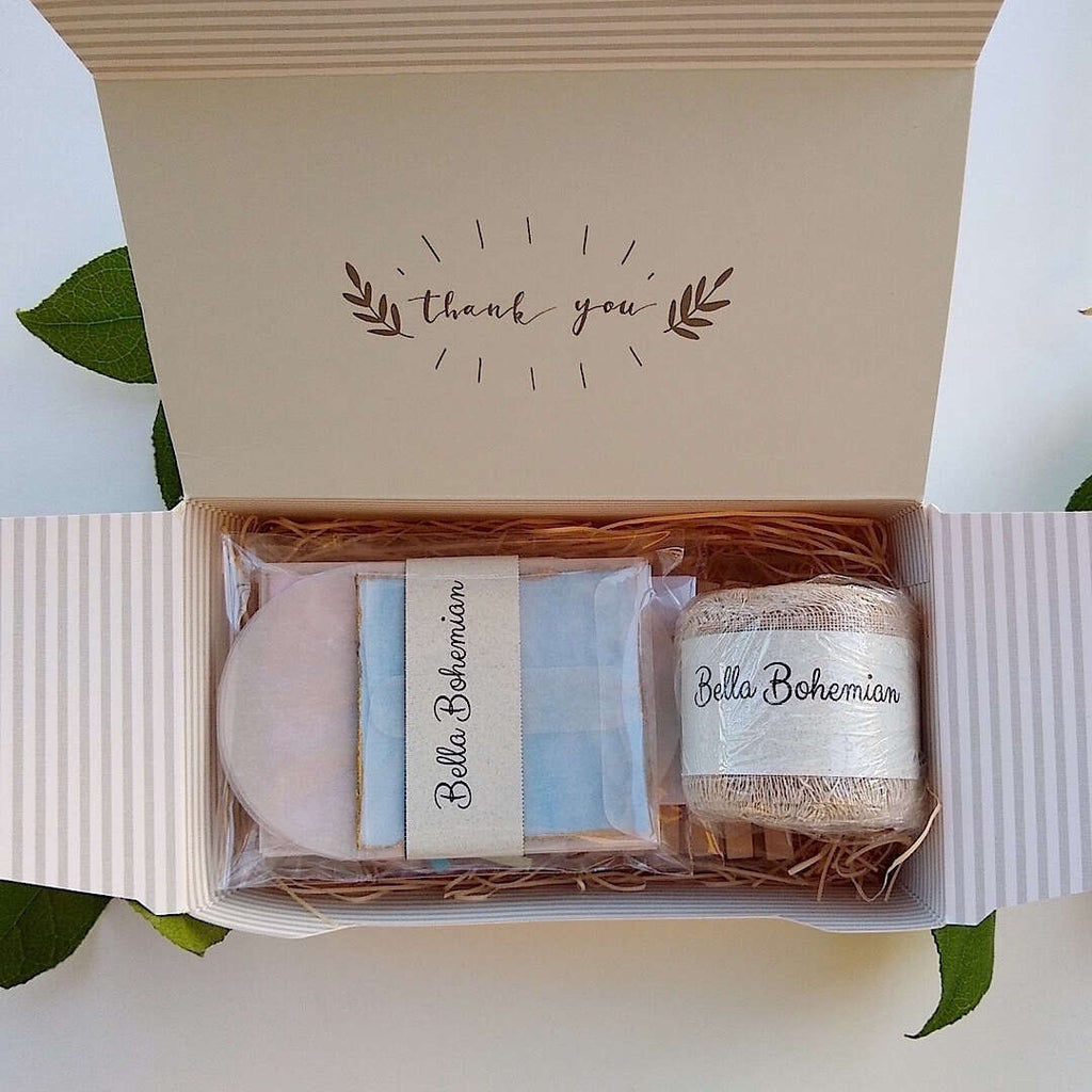 stationery kit with gift tags, linen ribbon, clothespins, glassine envelopes individually wrapped in a thank you gift box