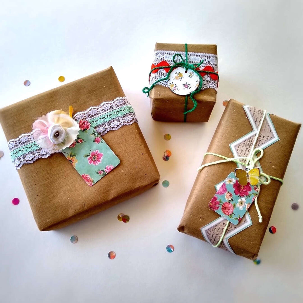 3 example wrapped gift boxes with gift tags by Bella Bohemian Papeterie