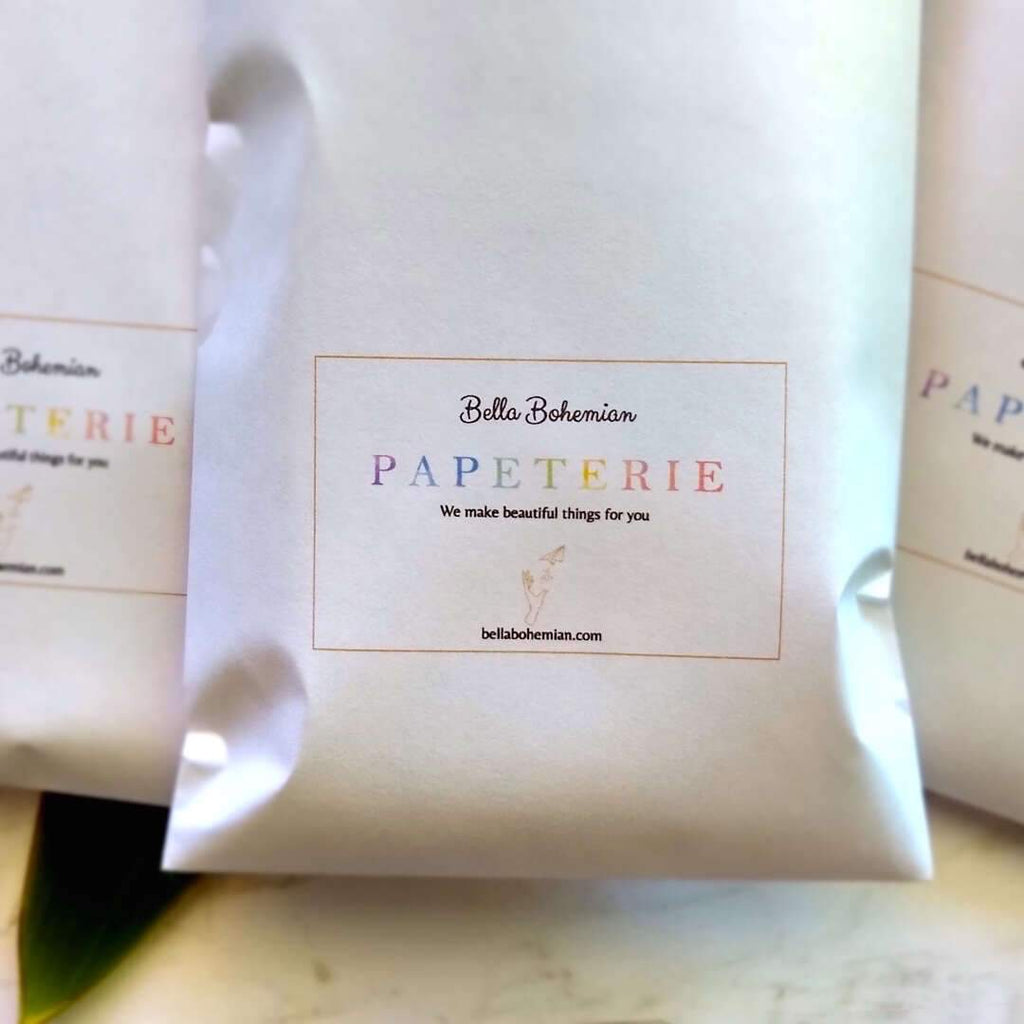 multiple papeterie packs packaged in Bella Bohemian branded envelope