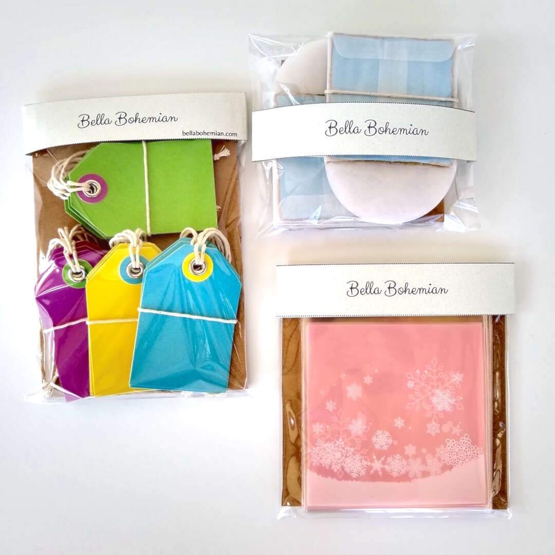 3 wrapped papeterie packs including gift tags, snowflakes favor bags, watercolor cards and glassine envelopes
