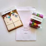 packages of 10 festive gift tags and 15 rolls of Washi tapes with papeterie envelope