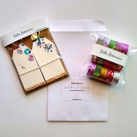 packages of 10 festive gift tags and 15 rolls of Washi tapes with papeterie envelope