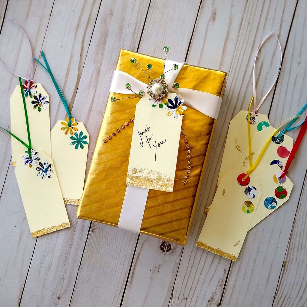 sample wrapped gift box with festive gift tags