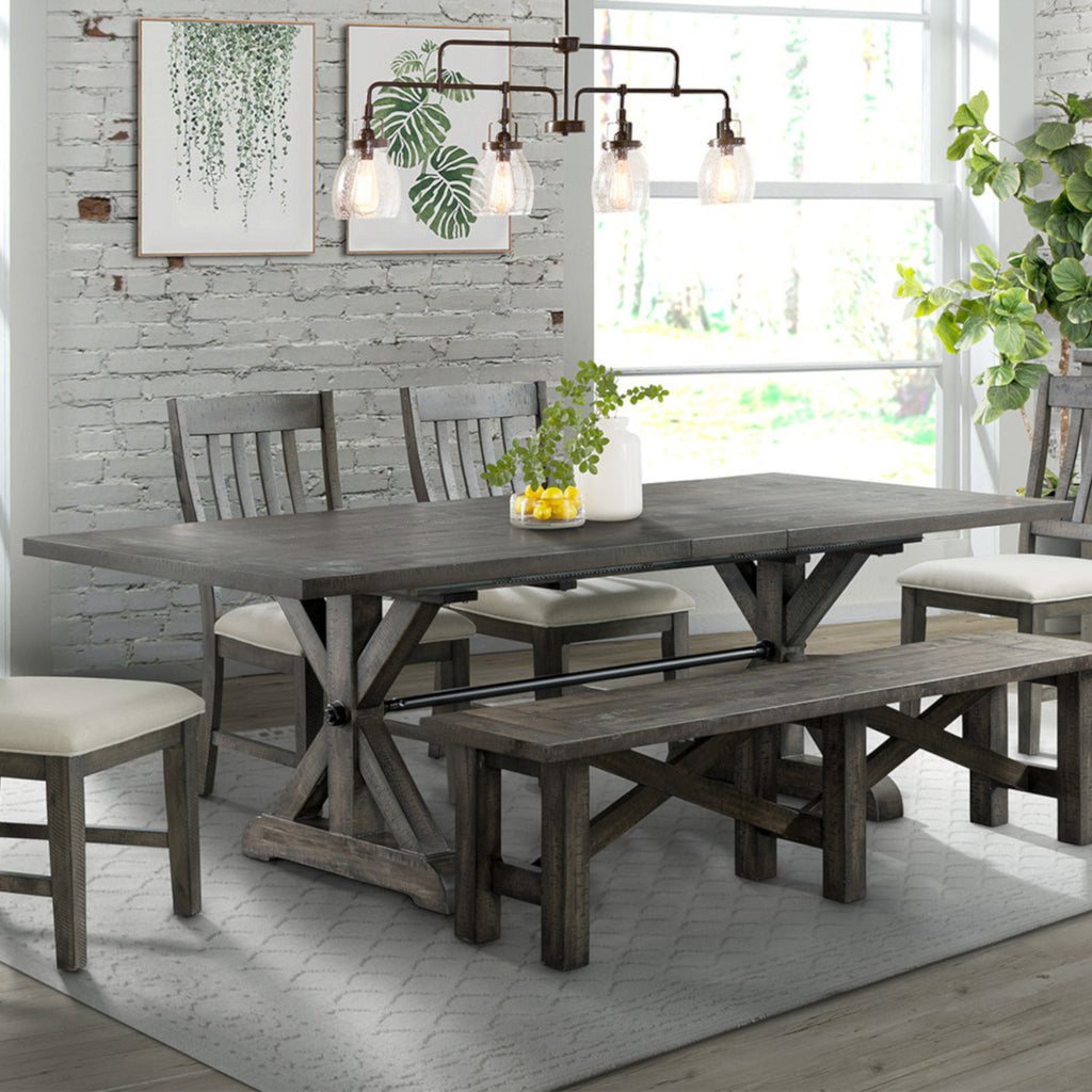 trestle dining table, four dining chairs and dining bench - showroom photo