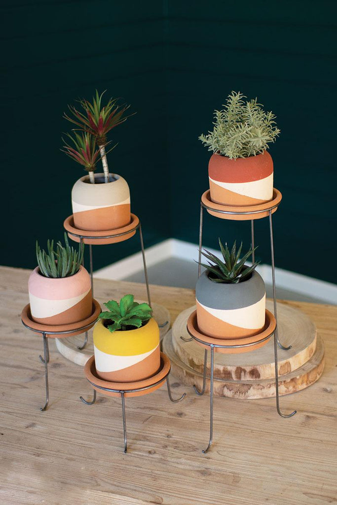 set of 5 multi-colored clay pots with metal bases