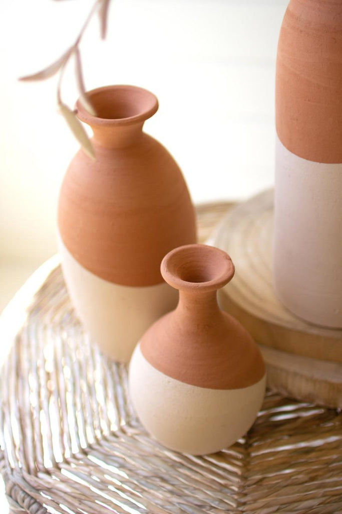 2 ivory dipped clay vases of different sizes and shapes - close-up view