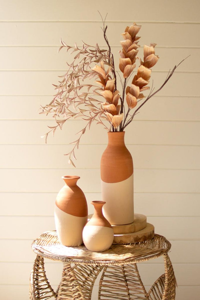 set of 3 ivory dipped clay vases of different sizes and shapes