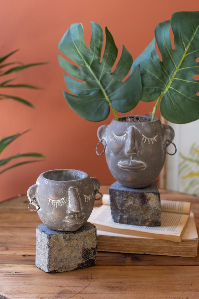 set of 2 clay faced pots with rock stands