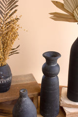 2 clay vases of varying shapes & sizes - close-up view