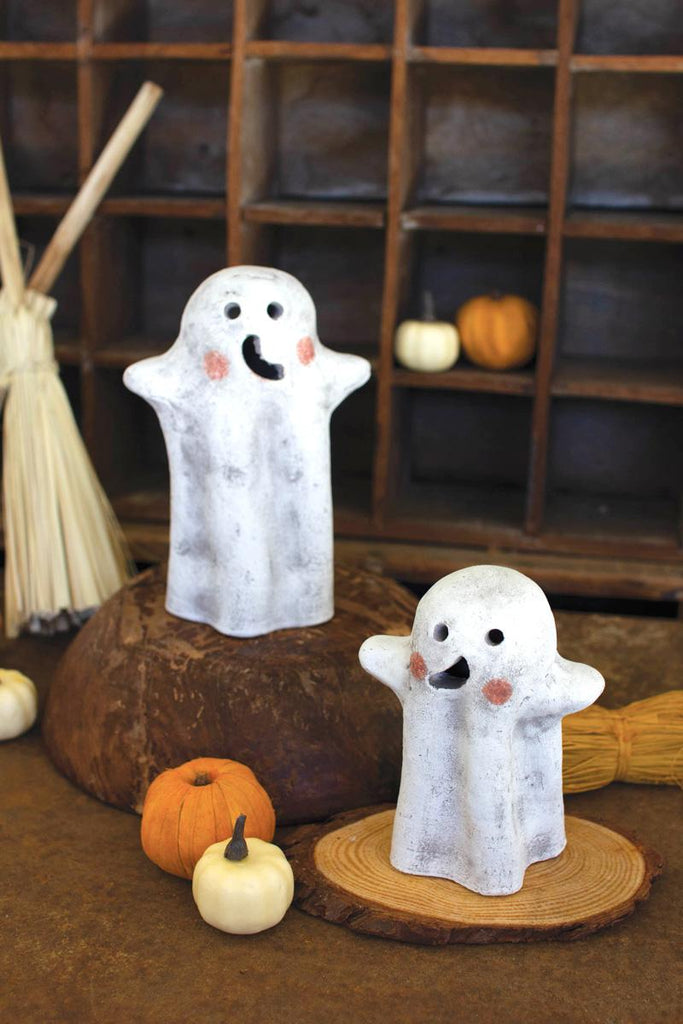 set of 2 clay ghost lanterns - arranged standing on pieces of wood