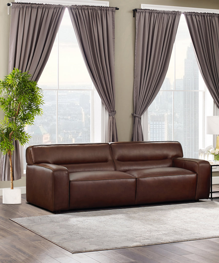 lombardy leather sofa in living room setting in front of two windows