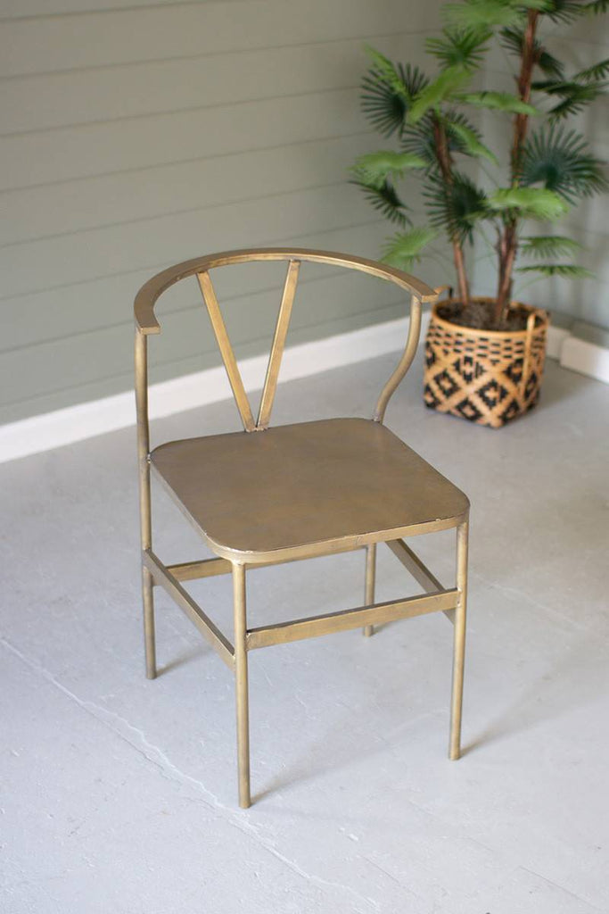 metal wishbone chair with brass finish