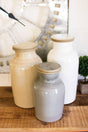 3 ceramic canisters beige gray white different sizes